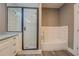 Bathroom features a glass shower, bathtub with tile surround, and modern fixtures at 577 Center Hill Nw Ave, Atlanta, GA 30318