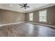 Spacious primary bedroom with large windows and luxury vinyl plank flooring at 577 Center Hill Nw Ave, Atlanta, GA 30318