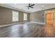 Spacious primary bedroom with large windows, ceiling fan and luxury vinyl plank flooring at 577 Center Hill Nw Ave, Atlanta, GA 30318