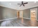 Spacious bedroom featuring hardwood floors, a ceiling fan and access to the Primary bathroom at 577 Center Hill Nw Ave, Atlanta, GA 30318