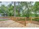 The wooden deck offers a scenic backyard view with steps leading down to the yard at 577 Center Hill Nw Ave, Atlanta, GA 30318