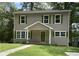 Charming two-story home with green shutters, a front porch, and a well-maintained lawn at 577 Center Hill Nw Ave, Atlanta, GA 30318