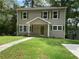 Charming two-story home with green shutters, front porch, and a well-maintained lawn at 577 Center Hill Nw Ave, Atlanta, GA 30318