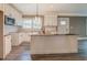 Beautiful kitchen with white cabinets, granite countertops and modern stainless steel appliances at 577 Center Hill Nw Ave, Atlanta, GA 30318