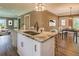 Kitchen island with granite countertops, stainless steel sink and goose neck faucet at 577 Center Hill Nw Ave, Atlanta, GA 30318