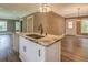 Kitchen island with granite countertops, stainless steel sink and goose neck faucet at 577 Center Hill Nw Ave, Atlanta, GA 30318