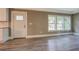 Bright living room featuring hardwood floors, and a view into the front yard at 577 Center Hill Nw Ave, Atlanta, GA 30318