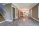 Bright, open-concept living room featuring hardwood floors, and a view into the kitchen at 577 Center Hill Nw Ave, Atlanta, GA 30318