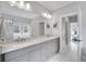 Stylish bathroom features double vanity, granite countertops, modern fixtures and natural lighting at 2304 Isla Run, Woodstock, GA 30188
