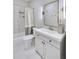 Updated bathroom features modern fixtures, sleek vanity, and tiled shower with stylish curtain at 2304 Isla Run, Woodstock, GA 30188