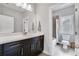 Well-lit bathroom featuring a sleek vanity with a dark wood finish and a combined shower and tub at 2304 Isla Run, Woodstock, GA 30188