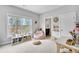 Bright bedroom with natural light, a cozy beanbag chair, and a view of the trees at 2304 Isla Run, Woodstock, GA 30188