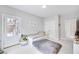 Bright bedroom featuring a modern bean bag chair and a door to the outside at 2304 Isla Run, Woodstock, GA 30188