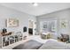 Bright bedroom featuring a playful decor, a sitting area, and easy access to an ensuite bathroom at 2304 Isla Run, Woodstock, GA 30188