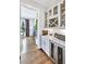 Butler's pantry with wine fridge, and granite countertops at 2304 Isla Run, Woodstock, GA 30188