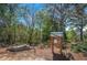 Community area features a library box surrounded by a peaceful landscape at 2304 Isla Run, Woodstock, GA 30188