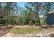 Tranquil community common area with park benches, mature shade trees, and serene atmosphere for relaxation at 2304 Isla Run, Woodstock, GA 30188