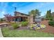 Community entrance featuring an Oakhurst welcome sign, stone pillars, and flowers at 2304 Isla Run, Woodstock, GA 30188