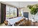 Bright dining room with large windows and modern lighting at 2304 Isla Run, Woodstock, GA 30188