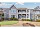 Charming two-story home with a welcoming double-decker porch and beautifully landscaped front yard at 2304 Isla Run, Woodstock, GA 30188