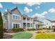 Beautiful two-story home with a welcoming double-decker porch and lovely landscaping at 2304 Isla Run, Woodstock, GA 30188