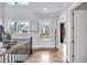 Bright foyer featuring hardwood floors, elegant staircase, and a welcoming entrance at 2304 Isla Run, Woodstock, GA 30188