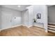 Inviting foyer with hardwood floors, a console table, and stylish decor at 2304 Isla Run, Woodstock, GA 30188