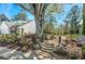 Charming front yard with professional landscaping, stone accents, and welcoming walkway to the home at 2304 Isla Run, Woodstock, GA 30188