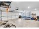 Spacious garage with ample storage space, a trampoline, and overhead racks at 2304 Isla Run, Woodstock, GA 30188