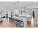 Modern kitchen with a large island, granite countertops and stainless steel appliances at 2304 Isla Run, Woodstock, GA 30188
