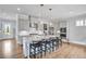 Spacious kitchen featuring a large island with bar seating and stainless steel appliances at 2304 Isla Run, Woodstock, GA 30188