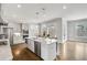 Stylish kitchen featuring a large island, stainless steel appliances and abundant cabinet space at 2304 Isla Run, Woodstock, GA 30188