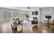 Bright and airy living room featuring a fireplace, hardwood floors, and an open layout at 2304 Isla Run, Woodstock, GA 30188