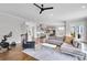 Open floor plan with kitchen, living and dining area with hardwood floors and ample natural light at 2304 Isla Run, Woodstock, GA 30188