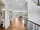 Open-concept living room with hardwood floors, large windows, and modern design elements at 2304 Isla Run, Woodstock, GA 30188