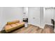 Cozy seating area with leather couch, desk and ample storage space in closet at 2304 Isla Run, Woodstock, GA 30188