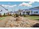 Community area with a stone fire pit and manicured landscaping at 2304 Isla Run, Woodstock, GA 30188