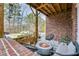 Inviting outdoor patio featuring a modern fire pit, seating and lush greenery at 2304 Isla Run, Woodstock, GA 30188