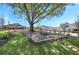 Community picnic area with picnic table, mature shade tree, and green space, perfect for outdoor gatherings at 2304 Isla Run, Woodstock, GA 30188