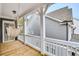Covered porch features a cozy hammock and wood decking at 2304 Isla Run, Woodstock, GA 30188