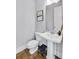Stylish powder room with pedestal sink and modern fixtures at 2304 Isla Run, Woodstock, GA 30188
