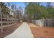 A serene walking path surrounded by natural beauty at 100 Duval Dr, Alpharetta, GA 30009