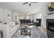 Open-concept living room featuring a fireplace and an adjacent modern kitchen and dining area at 3326 Springhaven Ave, Hapeville, GA 30354