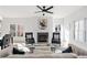 Bright living room featuring a fireplace, ceiling fan, neutral colors, and comfortable seating at 3326 Springhaven Ave, Hapeville, GA 30354