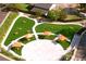 Aerial view of a playground with a padded play surface, swings, and shade structures at 3326 Springhaven Ave, Hapeville, GA 30354