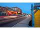 Street view showing building fronts and restaurant lighting with pedestrian walkways at 3326 Springhaven Ave, Hapeville, GA 30354