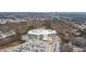 An aerial view shows the building and surrounding landscape in a wooded area with ample parking at 4374 Benfield Se Way # 1801Lo, Smyrna, GA 30080