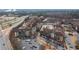 An aerial view displays residential apartments and roadways near a highway on a cloudy day at 4374 Benfield Se Way # 1801Lo, Smyrna, GA 30080