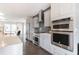 Modern kitchen featuring stainless steel appliances, gray cabinets, subway tile backsplash, and sleek countertops at 4374 Benfield Se Way # 1801Lo, Smyrna, GA 30080