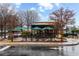 Starbucks with outdoor seating and green umbrellas at 4374 Benfield Se Way # 1801Lo, Smyrna, GA 30080